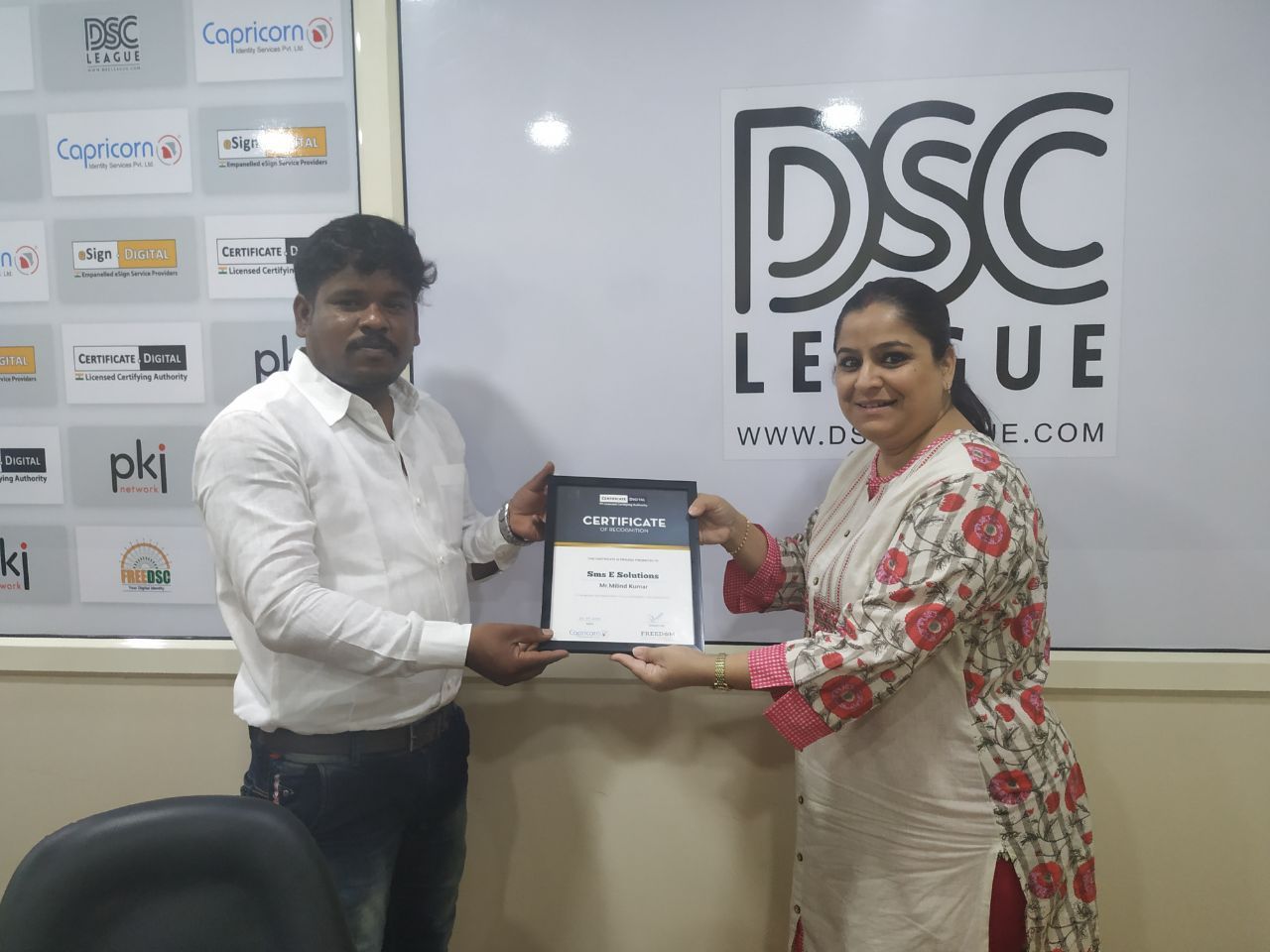 Certificate of recognition being presented to SMS E Solutions